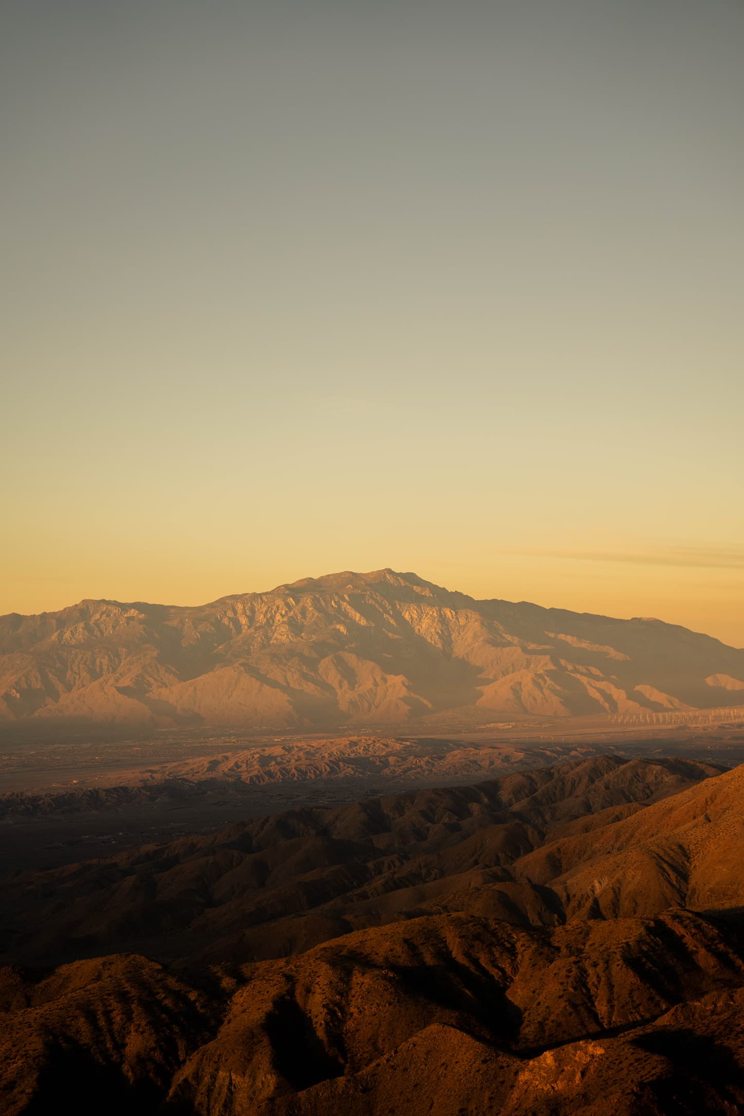 Golden desert mountains at sunset